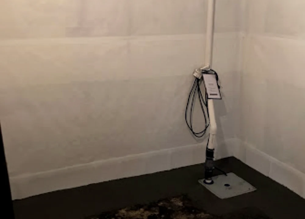 Finished vapor barrier and sump area by Sferra Waterproofing